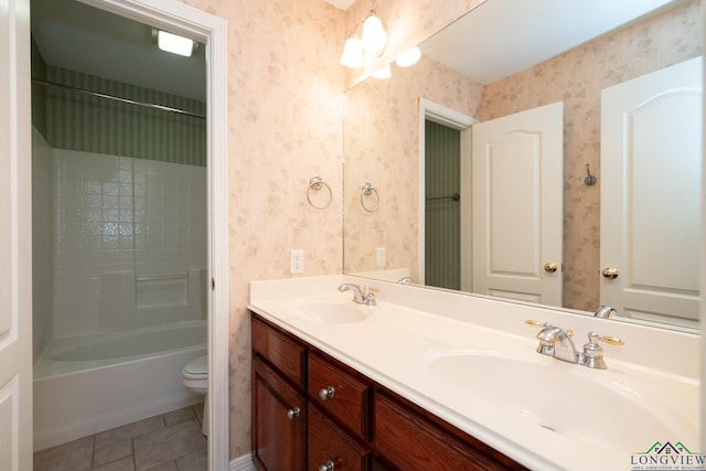 full bathroom featuring tile patterned floors, vanity, bathtub / shower combination, and toilet