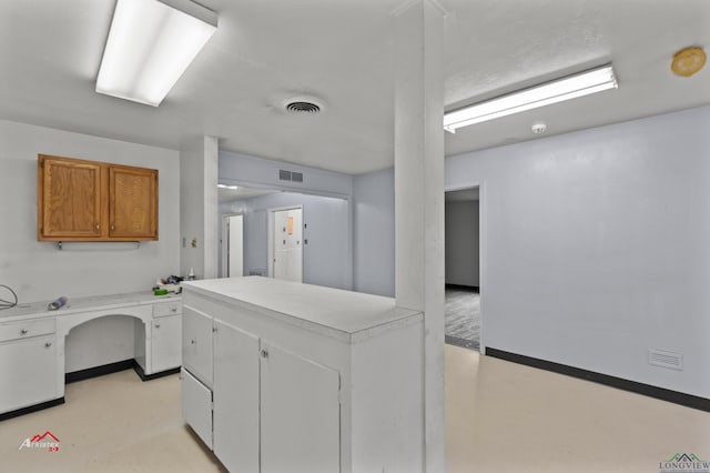 kitchen featuring white cabinets