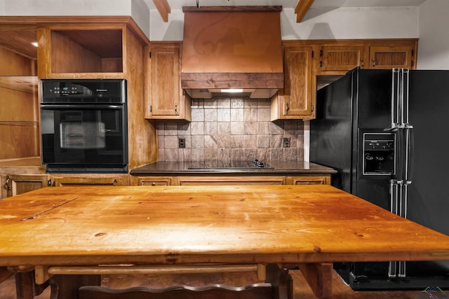 1011 Towne Lake Dr, Longview, TX 75601 - kitchen featuring black appliances, custom range hood, backsplash, and butcher block counters