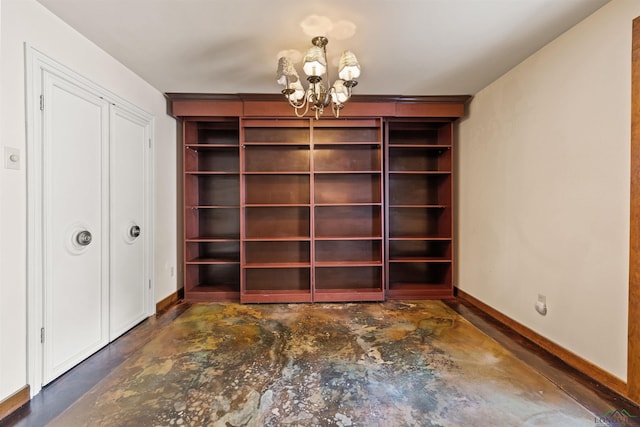 1011 Towne Lake Dr, Longview, TX 75601 - unfurnished dining area featuring concrete floors, a chandelier, and baseboards