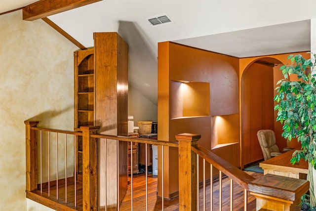 1011 Towne Lake Dr, Longview, TX 75601 - corridor with wood finished floors, vaulted ceiling, and arched walkways