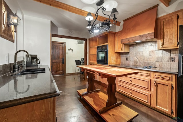 1011 Towne Lake Dr, Longview, TX 75601 - kitchen featuring black appliances, a sink, tasteful backsplash, custom range hood, and finished concrete floors