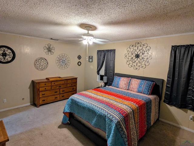 carpeted bedroom featuring crown molding, a ceiling fan, visible vents, and a textured ceiling