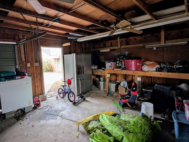 garage with washer / dryer and stainless steel fridge