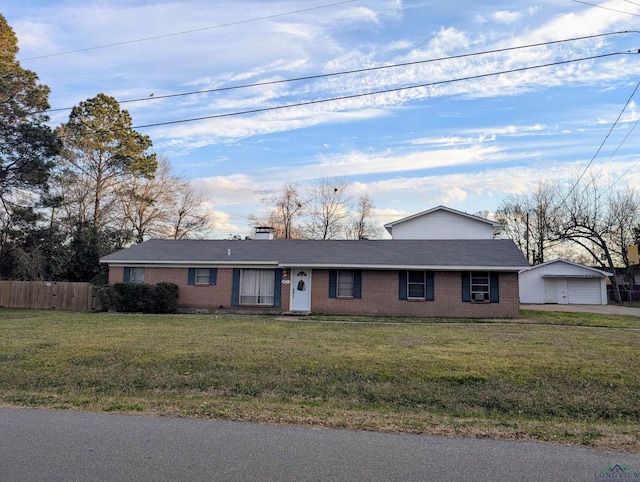 view of front of home featuring brick siding, a front yard, and fence