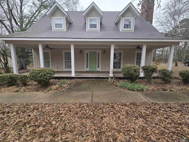 farmhouse-style home with ceiling fan and covered porch