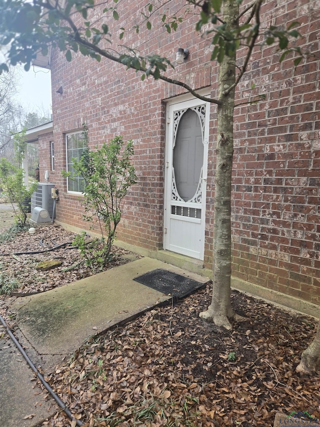 doorway to property with central air condition unit