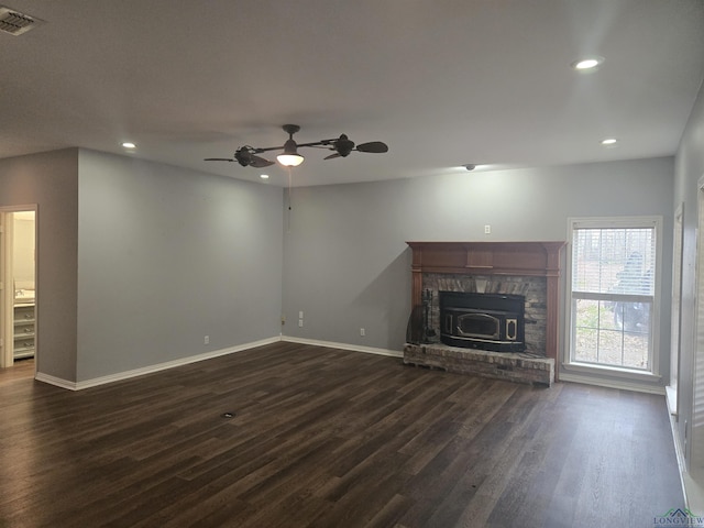 unfurnished living room with dark wood-type flooring and ceiling fan