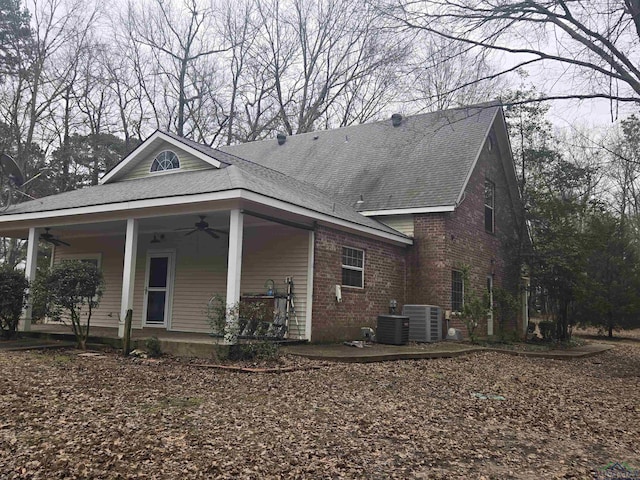 view of home's exterior featuring a porch, central AC unit, and ceiling fan