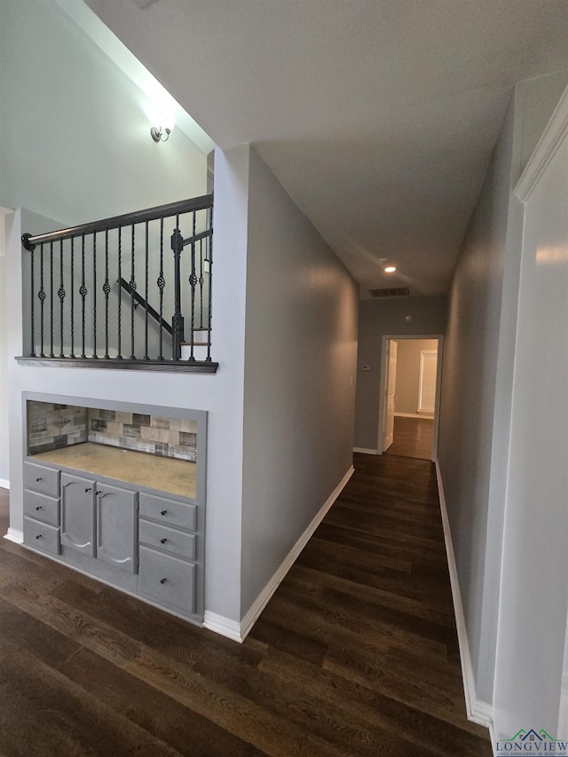 hallway featuring dark wood-type flooring