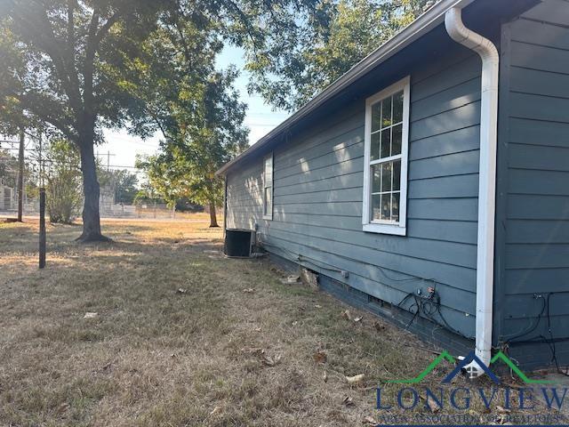 150 Wells St, Hawkins, TX 75765 - view of property exterior with central AC