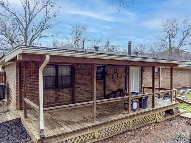 rear view of house with brick siding