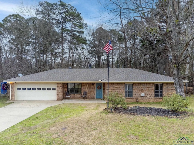 ranch-style home with brick siding, a shingled roof, concrete driveway, a garage, and a front lawn