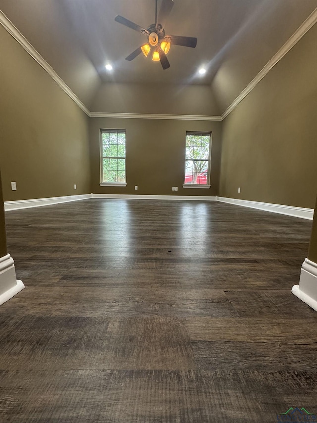 empty room with lofted ceiling, a ceiling fan, and a healthy amount of sunlight