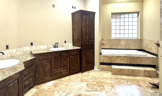 bathroom with a sink and a bath