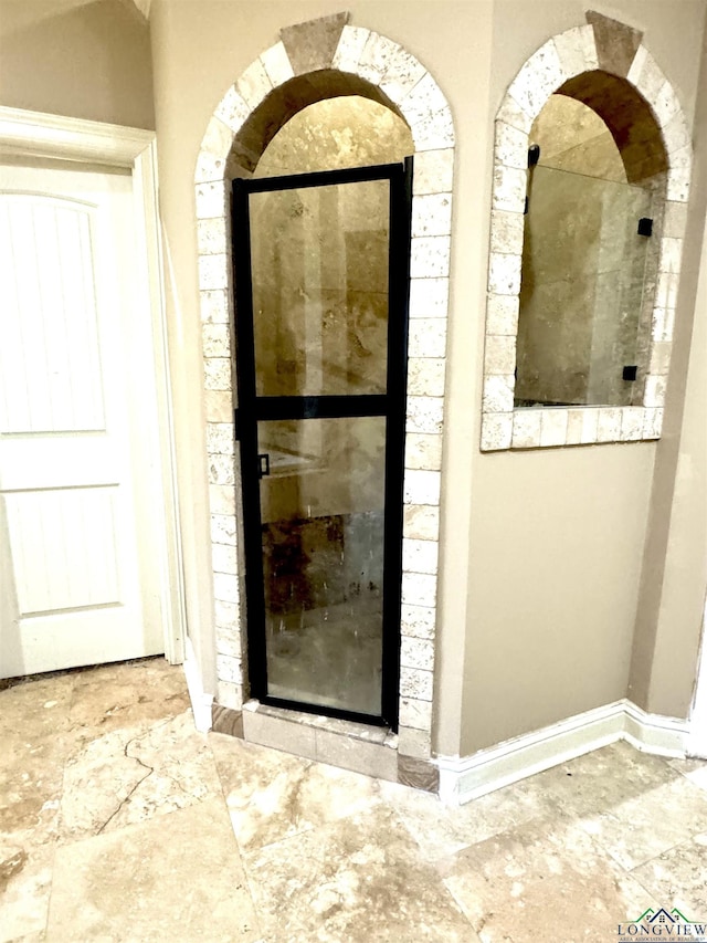 view of exterior entry with stucco siding