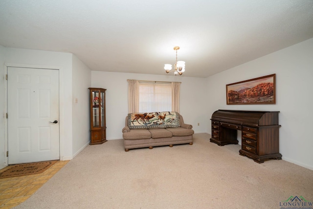 living area featuring carpet flooring and a chandelier