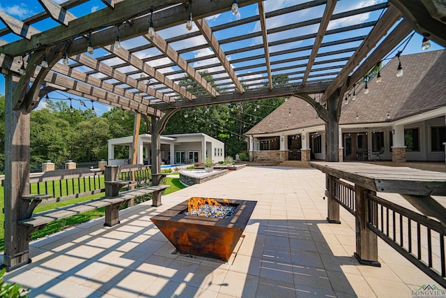 view of patio with a fire pit and a pergola