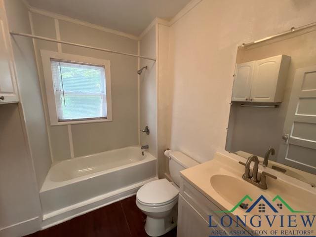 full bathroom with ornamental molding, toilet, shower / washtub combination, vanity, and hardwood / wood-style flooring