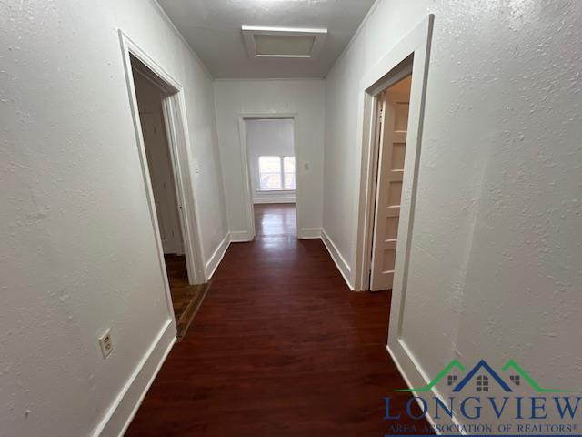 hall featuring dark wood-type flooring