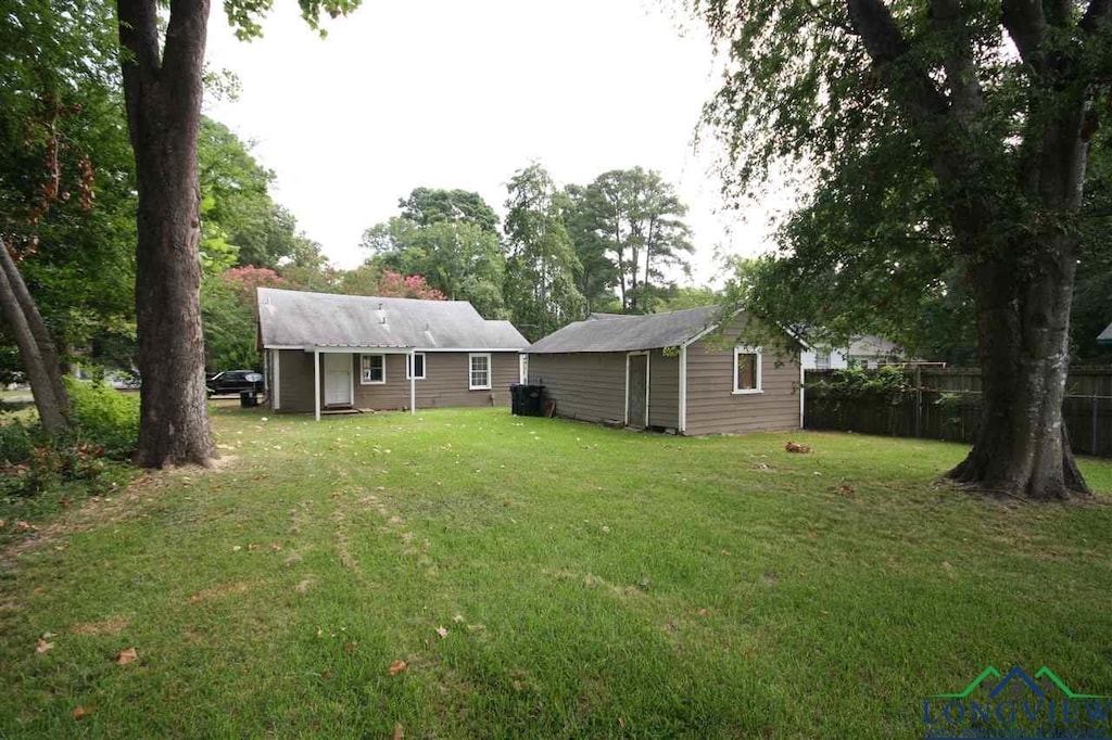 808 Owings St, Longview, TX 75602 - view of yard featuring an outbuilding