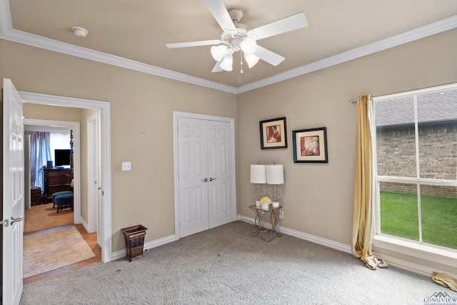 810 Crepe Myrtle Ln, Longview, TX 75604 - bedroom with carpet, ornamental molding, baseboards, a closet, and a ceiling fan