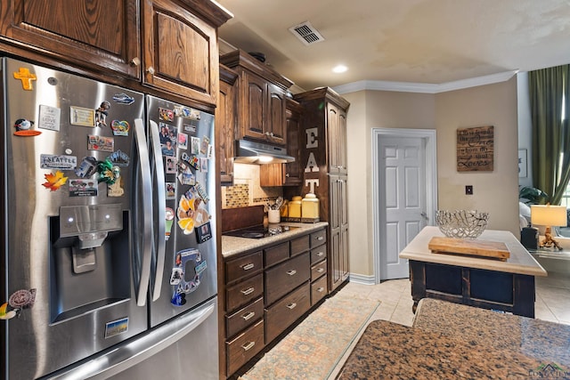 810 Crepe Myrtle Ln, Longview, TX 75604 - kitchen featuring stainless steel fridge, under cabinet range hood, decorative backsplash, black electric cooktop, and light tile patterned floors