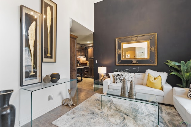 810 Crepe Myrtle Ln, Longview, TX 75604 - living room with tile patterned floors, baseboards, and a high ceiling