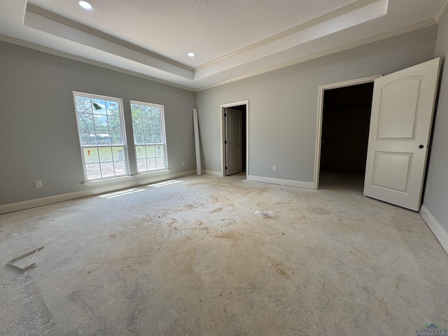 495 Lake Gladewater Rd, Gladewater, TX 75647 - unfurnished bedroom with a tray ceiling, ornamental molding, and recessed lighting