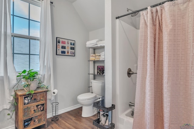 204 Hurley Ave, Gladewater, TX 75647 - bathroom featuring baseboards, vaulted ceiling, toilet, and wood finished floors