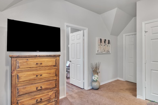 204 Hurley Ave, Gladewater, TX 75647 - bedroom featuring baseboards, light colored carpet, and vaulted ceiling