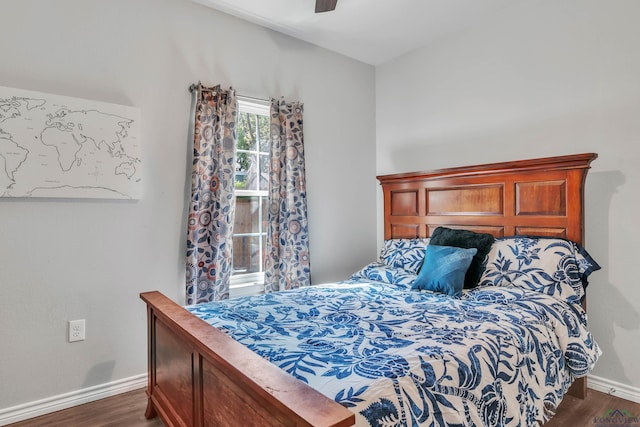 204 Hurley Ave, Gladewater, TX 75647 - bedroom featuring ceiling fan, baseboards, and dark wood finished floors
