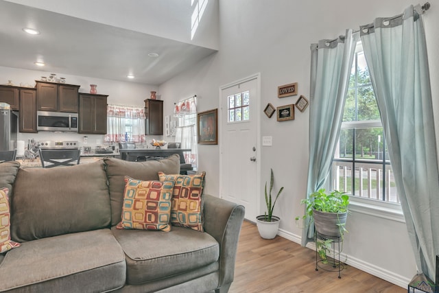204 Hurley Ave, Gladewater, TX 75647 - living area featuring recessed lighting, light wood-style floors, and baseboards