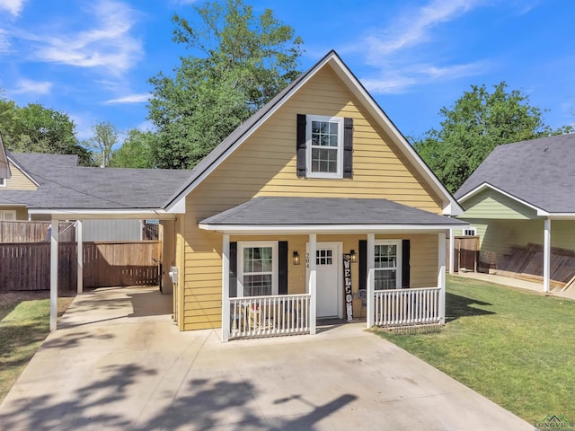 204 Hurley Ave, Gladewater, TX 75647 - bungalow with a porch, driveway, fence, and a front lawn