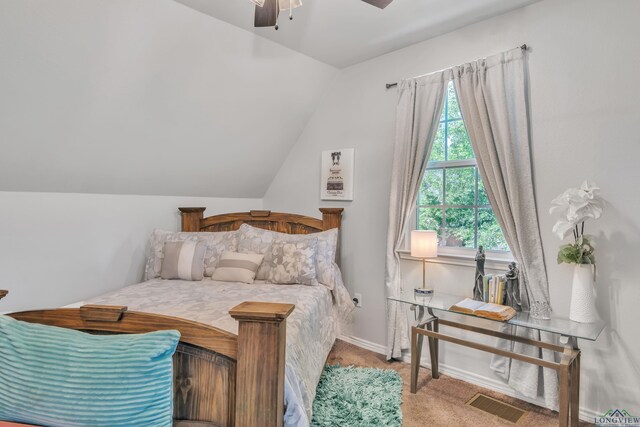 204 Hurley Ave, Gladewater, TX 75647 - bedroom with lofted ceiling, visible vents, ceiling fan, and carpet floors