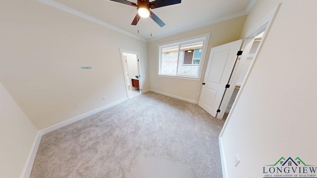 2509 Windmill Ln, Longview, TX 75601 - unfurnished bedroom featuring carpet floors, ornamental molding, and ceiling fan