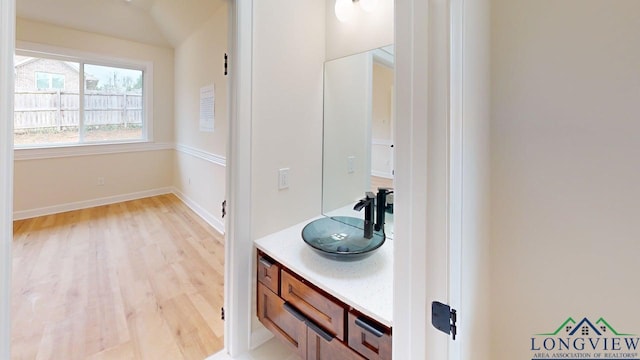 2509 Windmill Ln, Longview, TX 75601 - bathroom with wood finished floors and vanity