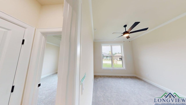 2509 Windmill Ln, Longview, TX 75601 - spare room featuring carpet, a ceiling fan, and ornamental molding