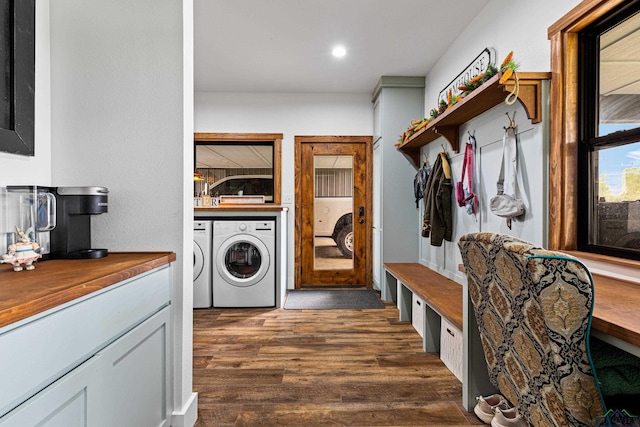 laundry area featuring dark wood-style flooring, recessed lighting, washing machine and dryer, and laundry area
