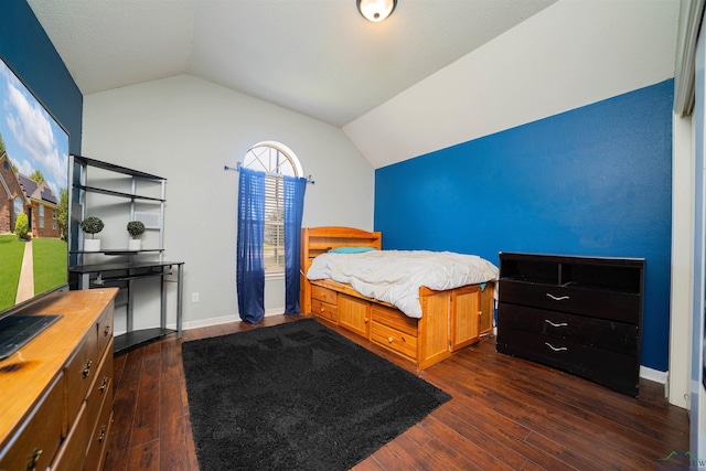 1505 Leach St, Kilgore, TX 75662 - bedroom featuring lofted ceiling, dark wood-style flooring, and baseboards