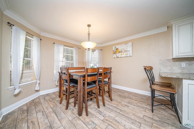 1505 Leach St, Kilgore, TX 75662 - dining room featuring ornamental molding, light wood finished floors, and baseboards