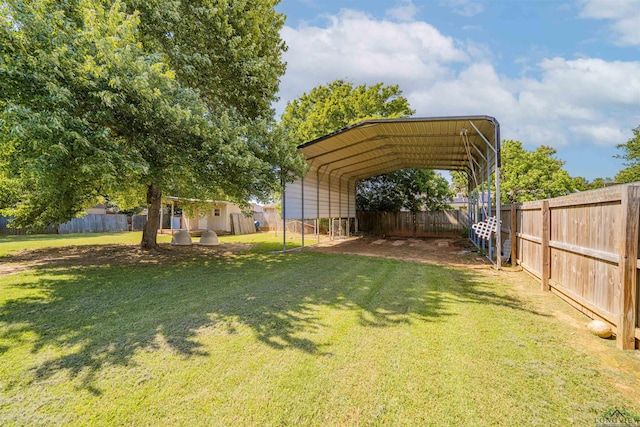 1505 Leach St, Kilgore, TX 75662 - view of yard featuring a carport and driveway