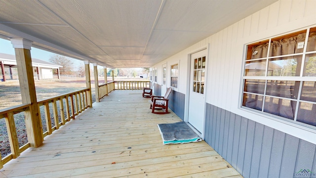 wooden deck featuring covered porch