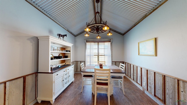 dining room featuring lofted ceiling and dark wood-type flooring