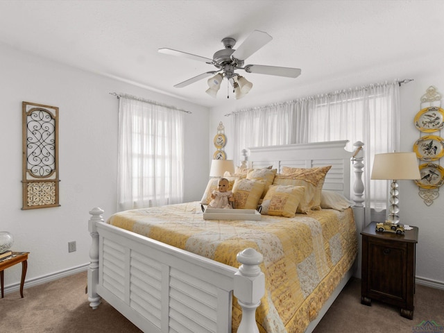 bedroom with carpet flooring, ceiling fan, and baseboards