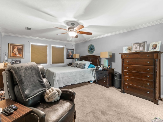 bedroom featuring carpet floors, visible vents, ornamental molding, and a ceiling fan