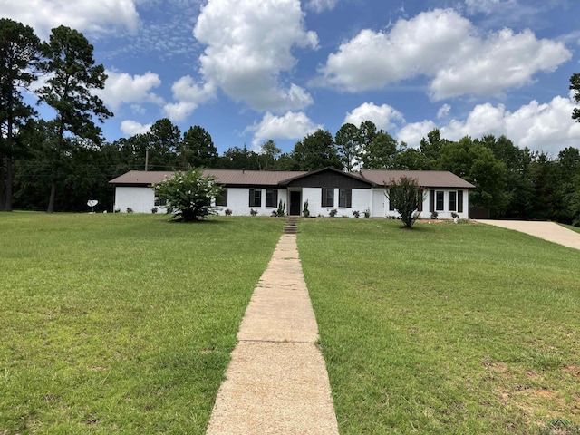 single story home with a front yard