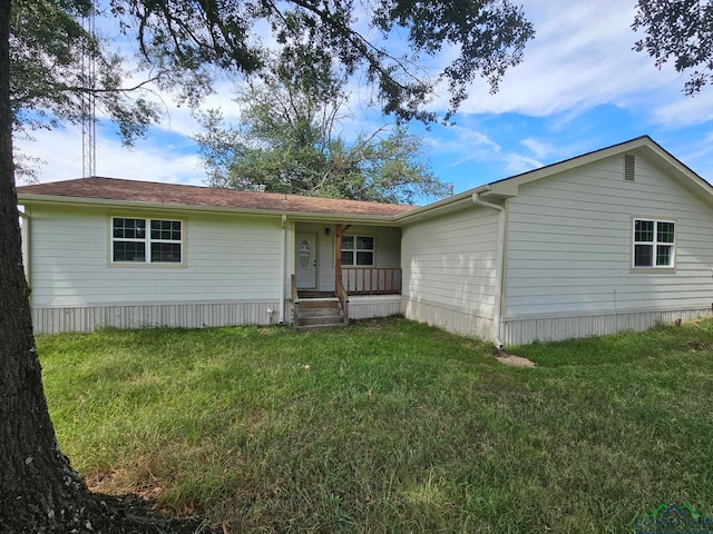 manufactured / mobile home with a porch and a front yard