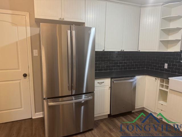 kitchen featuring appliances with stainless steel finishes, white cabinets, and dark hardwood / wood-style flooring