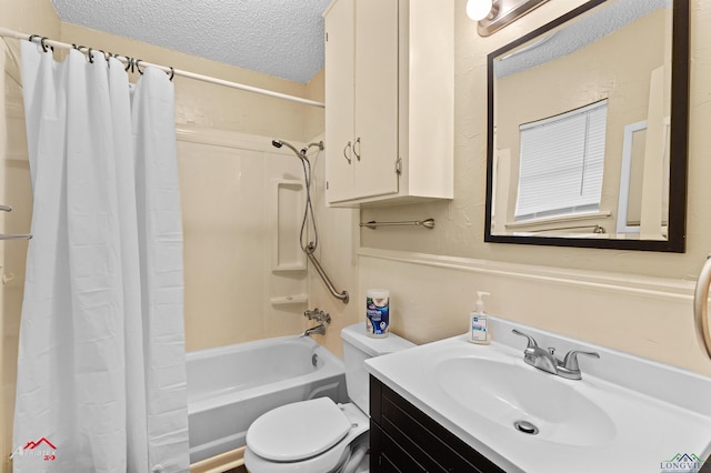 bathroom featuring vanity, toilet, shower / bath combo, and a textured ceiling